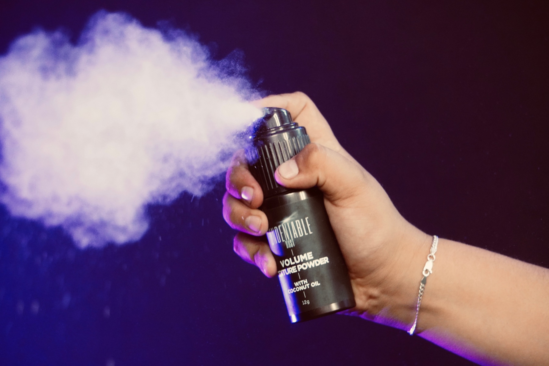 Undeniable Dust Volume Texture Powder being sprayed